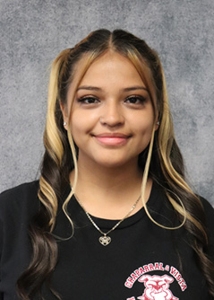 Female student wearing school black school shirt with school logo